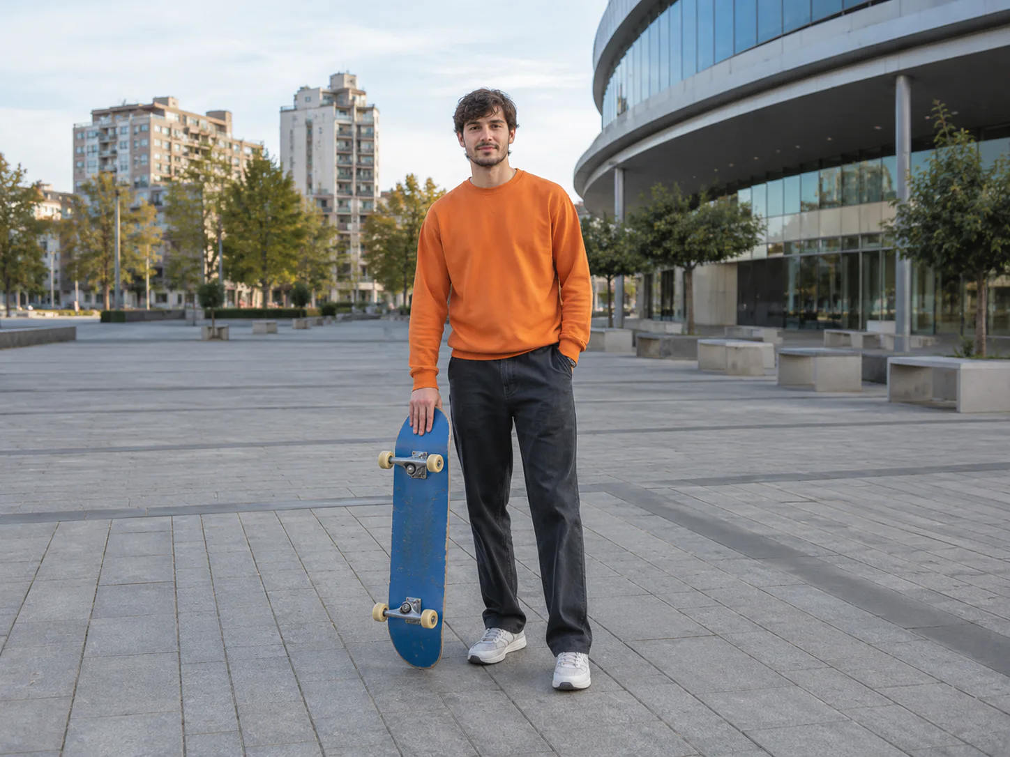 Undistorted photograph of a skateboarder in a city plaza